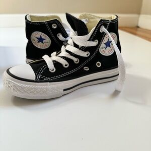 Converse Chuck Taylor Black and White High Tops. New with box. Never worn.
